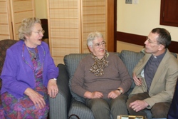 Open Door Club regulars Sadie Minford and Gwen Birch chat with the Rev John Rutter of Glenavy Parish